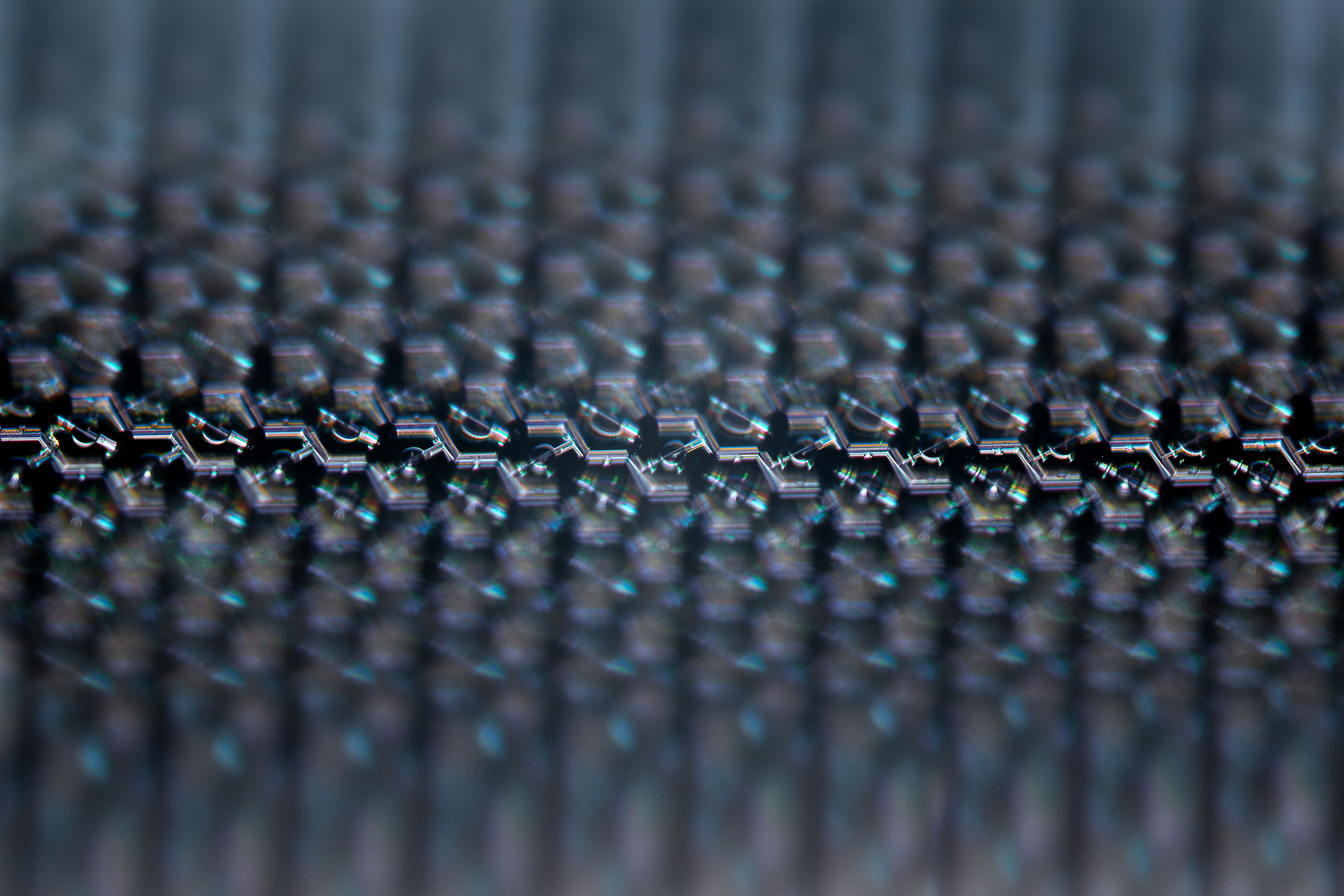Extreme closeup image of the tiny, repeating hexagonal pattern of a PRIMA implant.