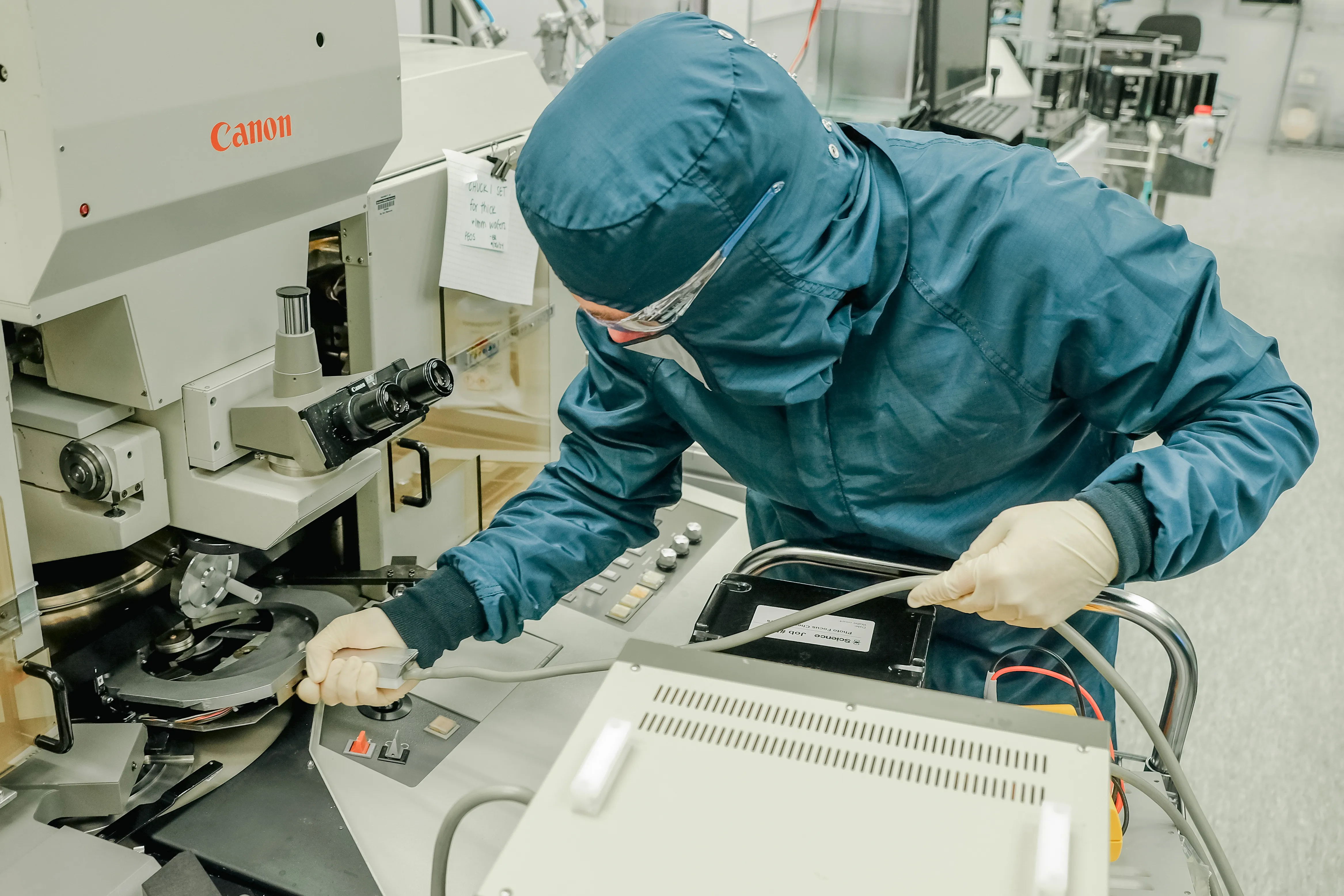An engineer calibrates a tool in the cleanroom at the Durham office.