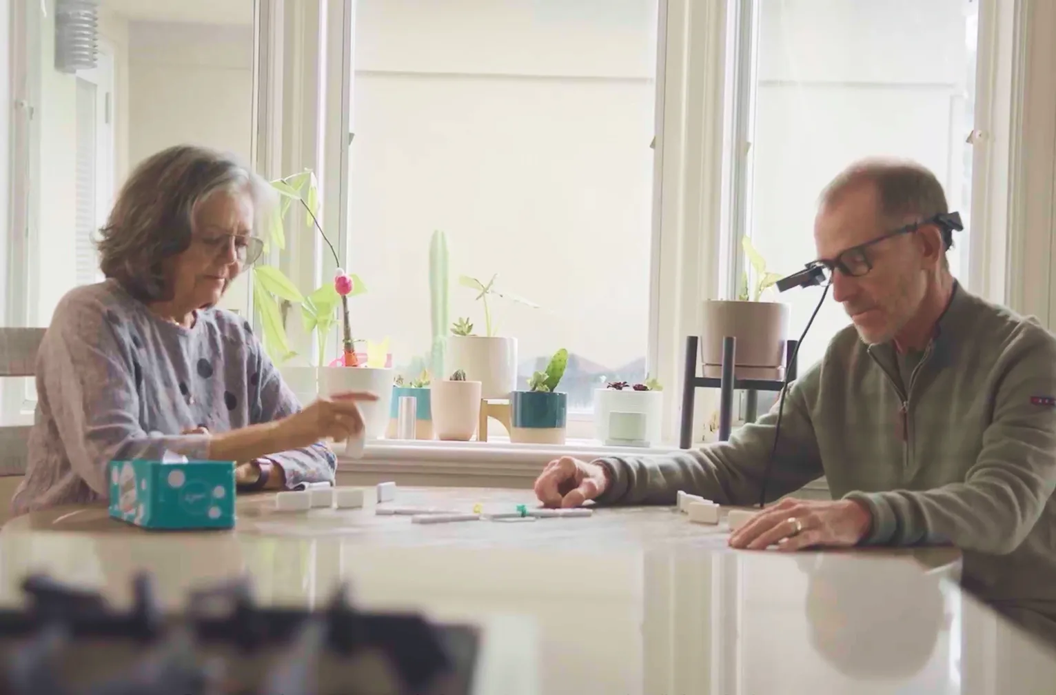 Photo of an actor reading a newspaper with the PRIMA system.