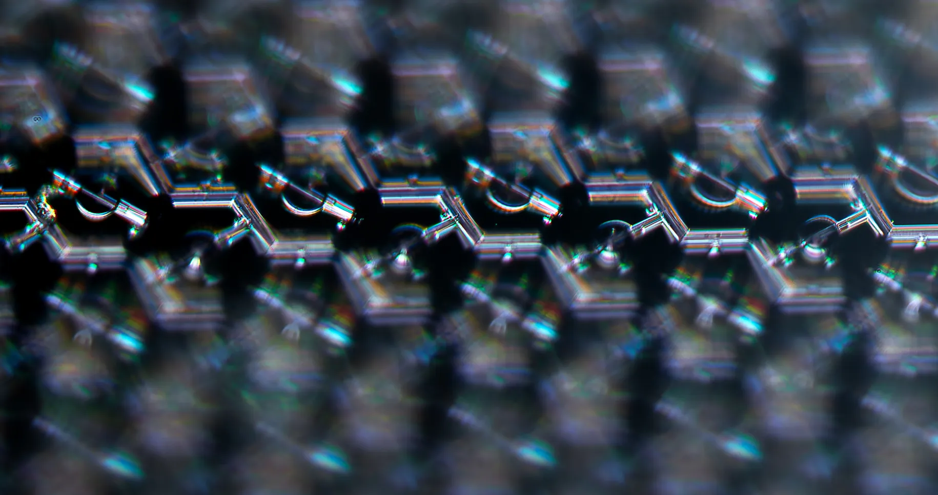 A magnified image of the PRIMA implant showing its hexagonal grid of independently controlled, light-powered electrodes.