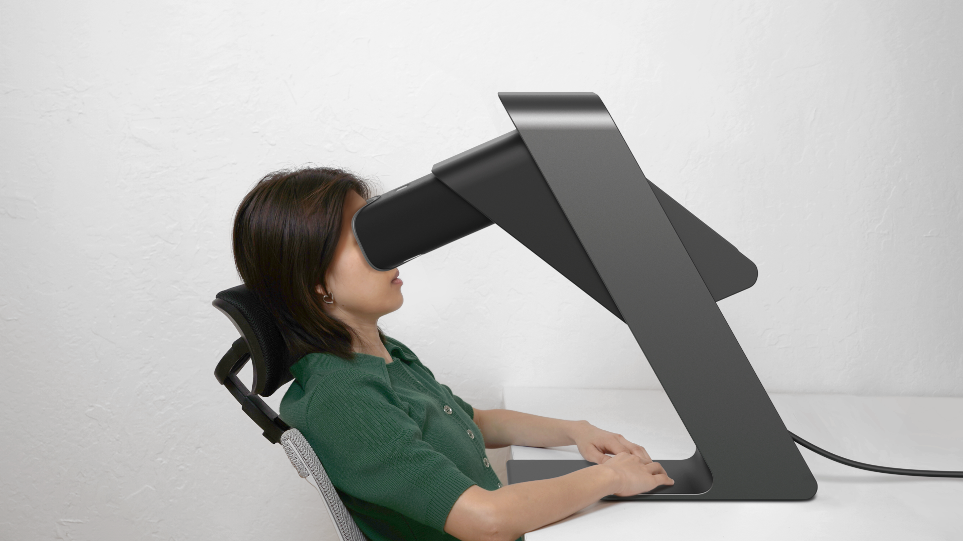 A render of a seated person leaning back with the scope tilted forward to match their position.