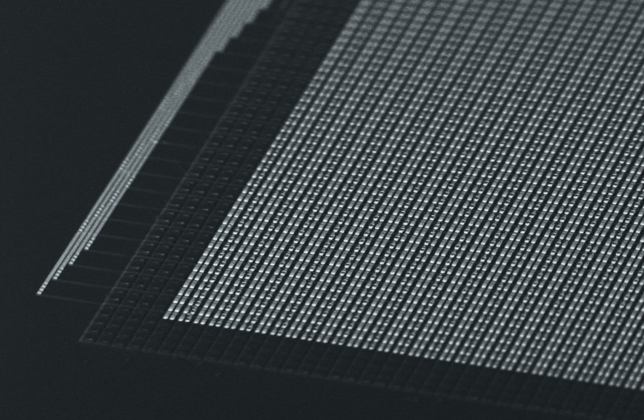 Scanning electron microscope image of an array of electrodes and microLEDs on a thin film.